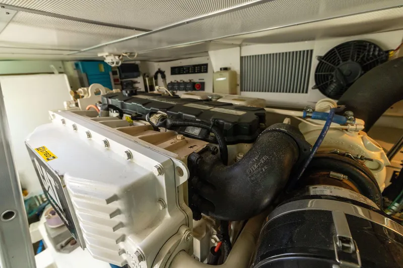 Slide: The Image of Engine room of 2008 Grand Banks 45 Eastbay SX yacht, showcasing detailed machinery components. - 56