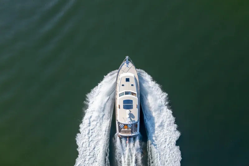 Slide: The Image of Aerial view of 2008 Grand Banks 45 Eastbay SX yacht cruising on water. - 63