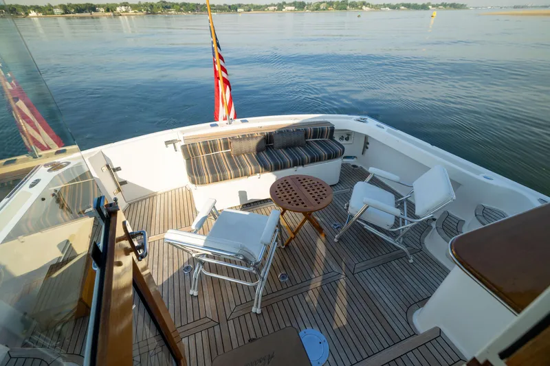Slide: The Image of Luxury deck of 2008 Grand Banks 45 Eastbay SX yacht with seating and American flag. - 9