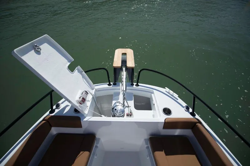 Slide: The Image of 2024 Beneteau Flyer 8 SPACEdeck bow with anchor locker open on calm water. - 14