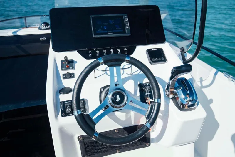 Slide: The Image of 2024 Beneteau Flyer 8 SPACEdeck helm with modern controls and steering wheel. - 25