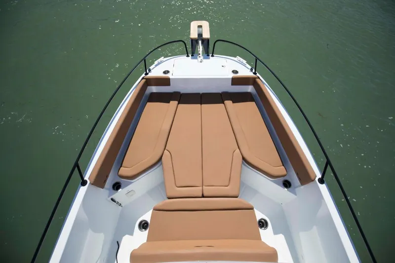 Slide: The Image of 2024 Beneteau Flyer 8 SPACEdeck bow seating area with tan cushions. - 6