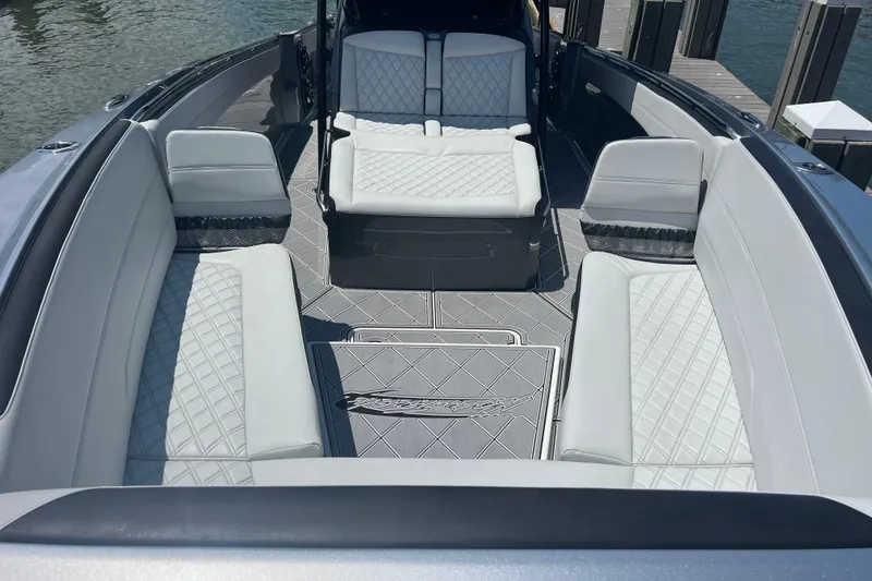 Slide: The Image of 2022 Nor-Tech 390 Sport Center Console with luxurious seating and sleek design. - 12