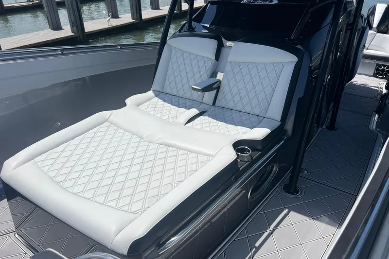 Slide: The Image of 2022 Nor-Tech 390 Sport Center Console with luxurious seating and sleek design. - 13