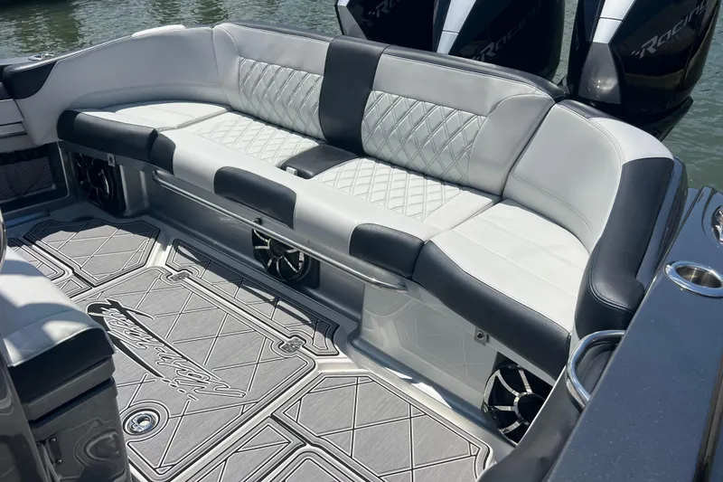 Slide: The Image of Luxurious seating on 2022 Nor-Tech 390 Sport Center Console boat, featuring elegant upholstery and design. - 16