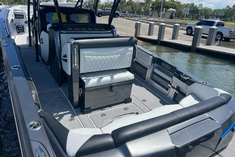 Slide: The Image of 2022 Nor-Tech 390 Sport Center Console boat interior with luxurious seating and modern design. - 6