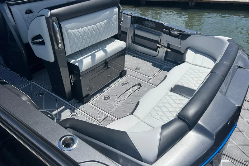 Slide: The Image of 2022 Nor-Tech 390 Sport Center Console with luxurious seating and sleek design. - 7