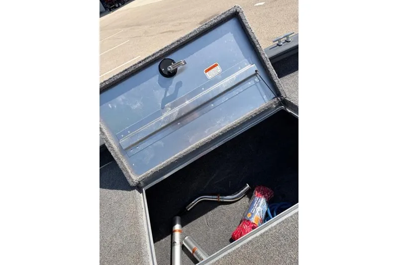Slide: The Image of Open storage compartment in 2016 Tracker Pro Team 195 TXW Tournament Edition boat. - 13