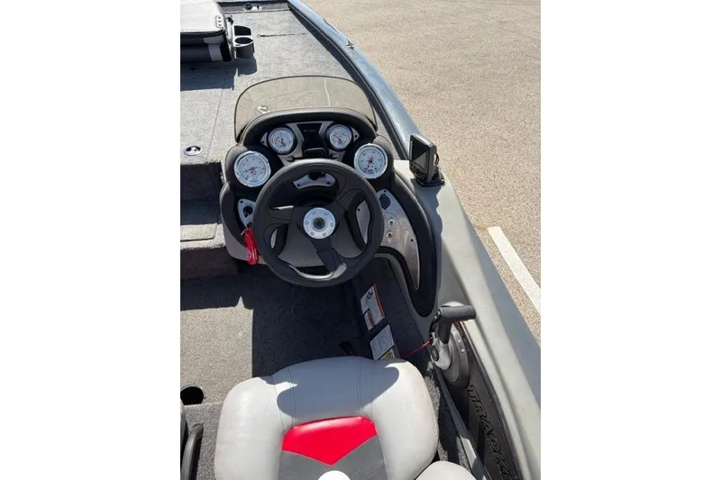 Slide: The Image of 2016 Tracker Pro Team 195 TXW Tournament Edition boat cockpit with steering wheel and gauges. - 15