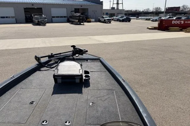 Slide: The Image of 2016 Tracker Pro Team 195 TXW Tournament Edition boat in a parking lot. - 16
