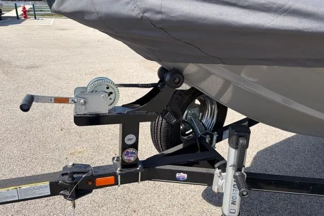 Slide: The Image of 2016 Tracker Pro Team 195 TXW Tournament Edition boat trailer with cover and winch. - 19