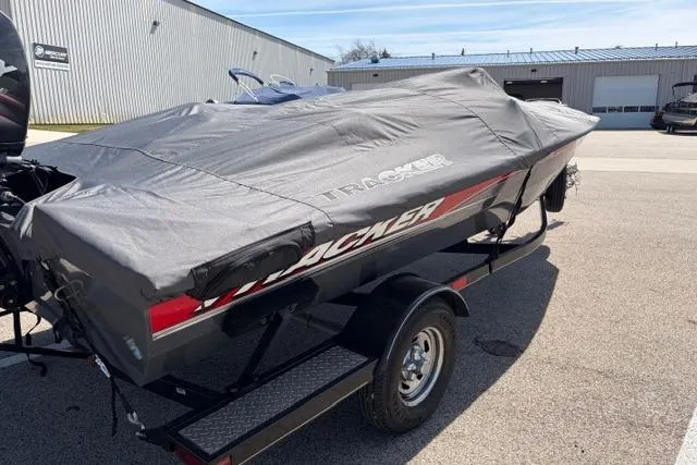 Slide: The Image of 2016 Tracker Pro Team 195 TXW Tournament Edition boat covered on trailer. - 5