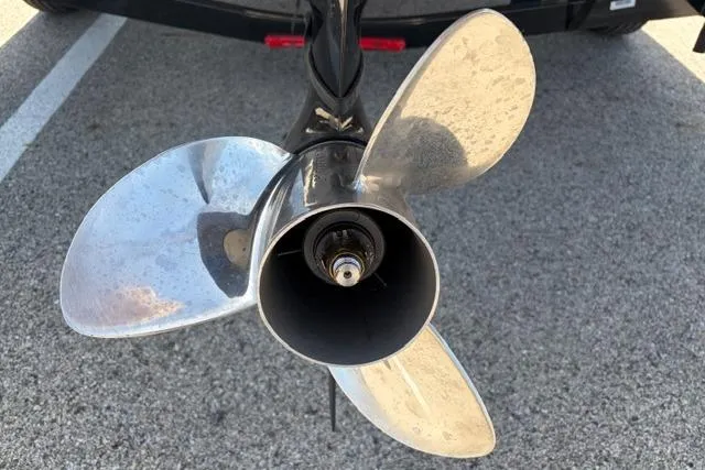 Slide: The Image of Propeller of 2016 Tracker Pro Team 195 TXW Tournament Edition boat on pavement. - 7