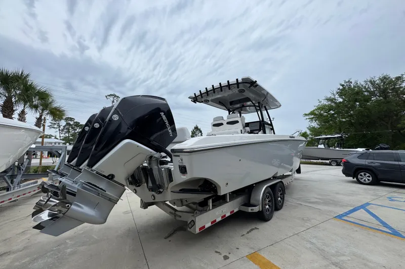 Slide: The Image of 2021 Fountain 34 Center Console boat with powerful Mercury engines on a trailer. - 11