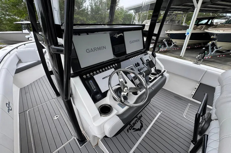 Slide: The Image of 2021 Fountain 34 Center Console boat with Garmin navigation system and sleek interior design. - 26