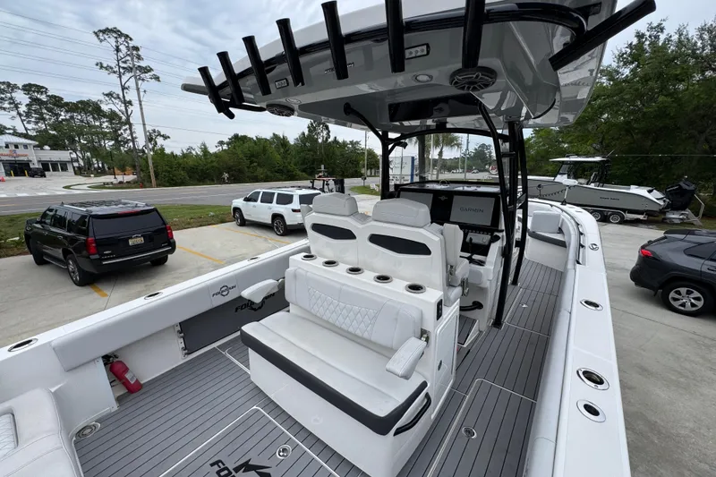 Slide: The Image of 2021 Fountain 34 Center Console boat with sleek seating and modern navigation system. - 34