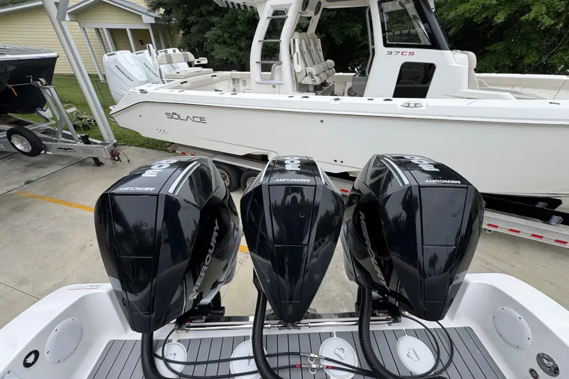 Slide: The Image of Triple Mercury outboard engines on a 2021 Fountain 34 Center Console boat. - 37