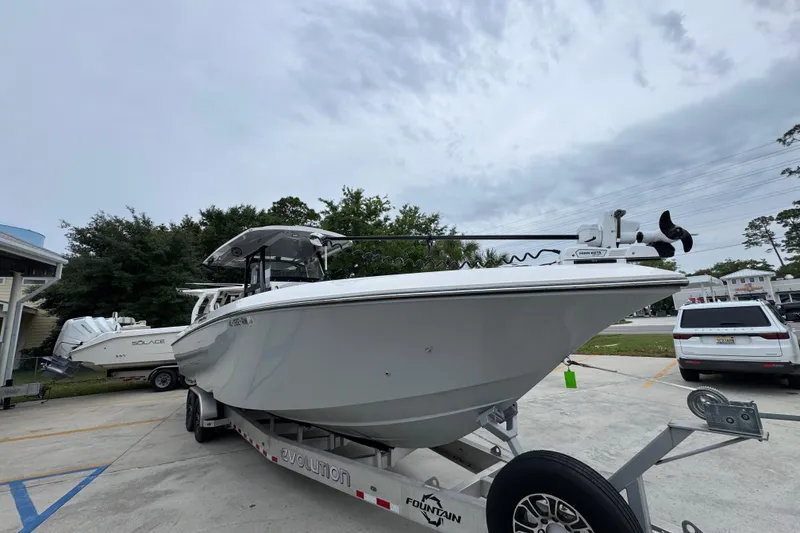Slide: The Image of 2021 Fountain 34 Center Console boat on trailer, parked outdoors. - 7