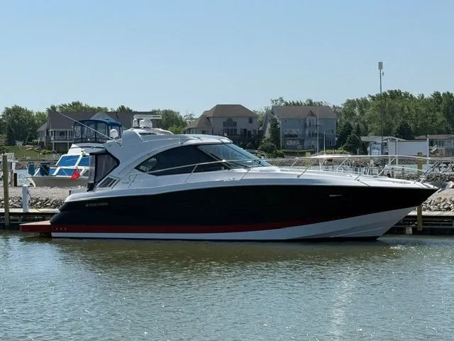 The Image of 2009 Four Winns V435 yacht docked on a sunny day. - 0
