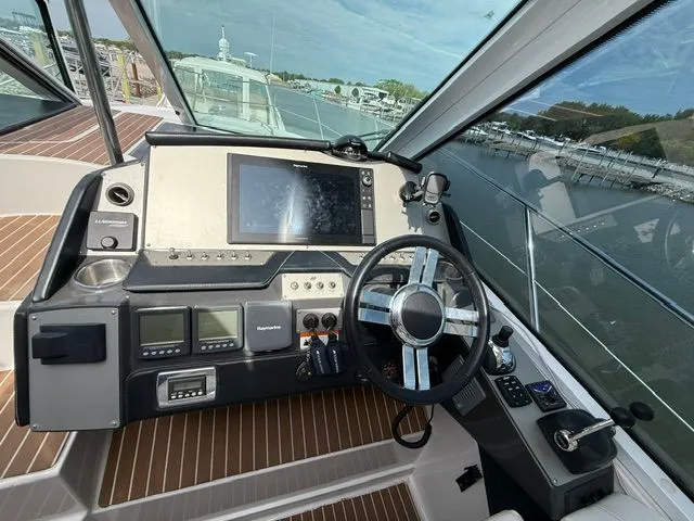 Slide: The Image of 2009 Four Winns V435 yacht cockpit with controls and electronics. - 10