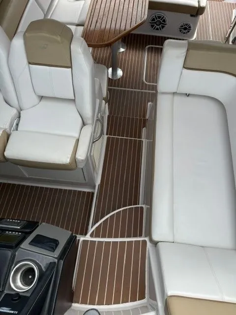 Slide: The Image of Interior of a 2009 Four Winns V435 yacht with white seating. - 13