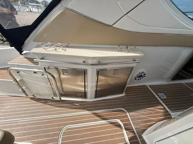 Slide: The Image of Interior of a 2009 Four Winns V435 yacht with wooden flooring. - 14