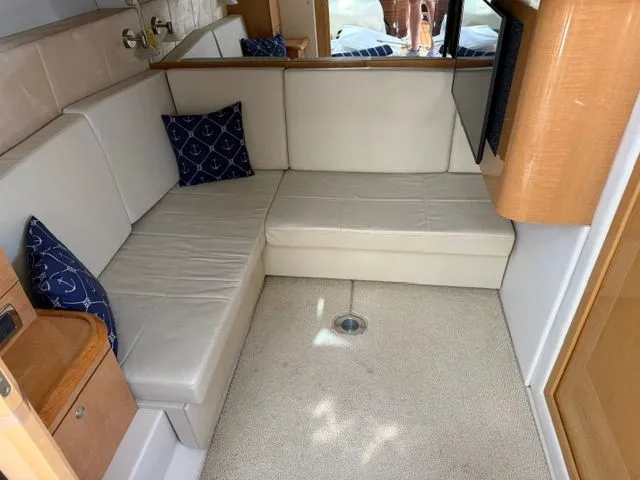 Slide: The Image of Interior of a 2009 Four Winns V435 yacht with white sofa. - 16