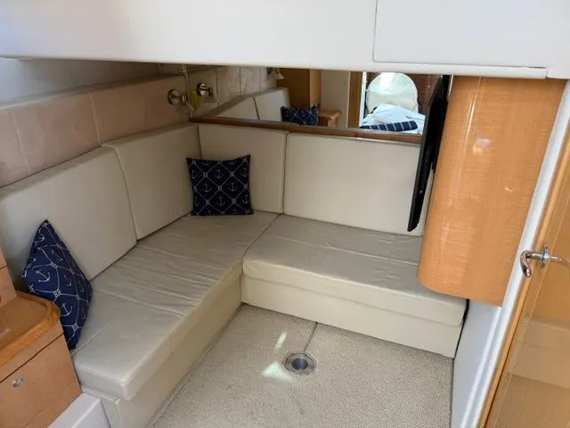 Slide: The Image of Interior of 2009 Four Winns V435 yacht with beige sofa. - 17