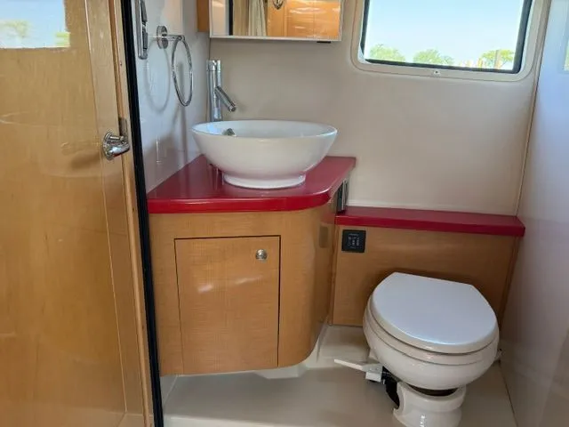 Slide: The Image of 2009 Four Winns V435 yacht bathroom with sink and toilet. - 18