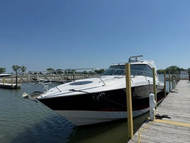 Slide: The Image of 2009 Four Winns V435 yacht docked on a sunny day. - 2
