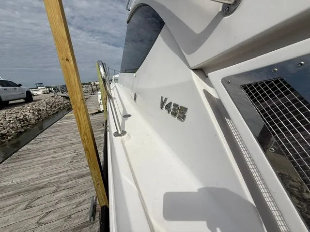 Slide: The Image of 2009 Four Winns V435 yacht docked, side view. - 6