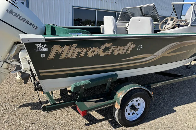 Slide: The Image of 2003 MirroCraft 1737 Holiday boat with Johnson outboard motor on trailer. - 3