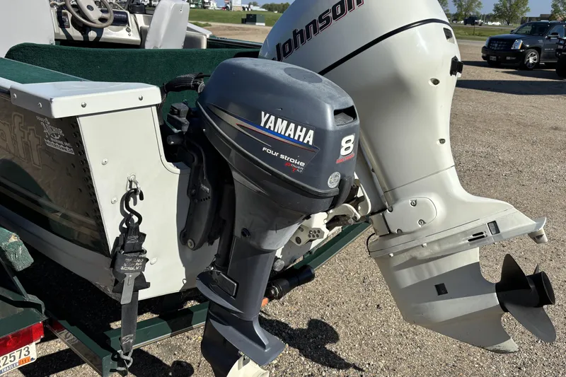 Slide: The Image of 2003 MirroCraft 1737 Holiday boat with Yamaha and Johnson outboard motors. - 5