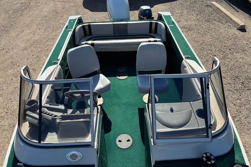 Slide: The Image of 2003 MirroCraft 1737 Holiday boat with green interior and dual windshields. - 7