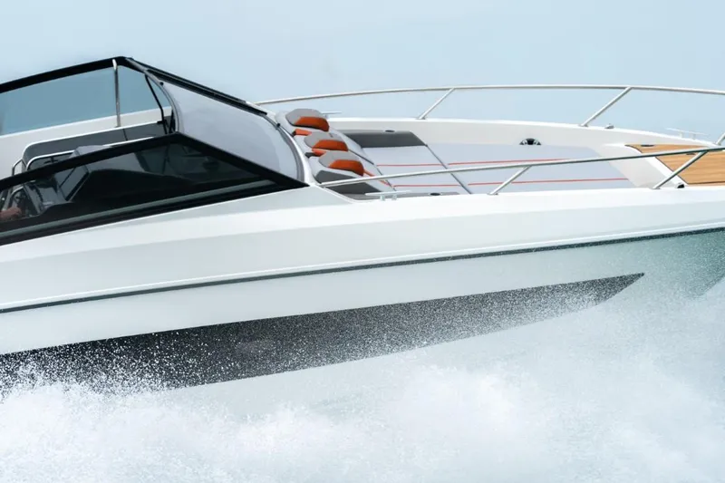 Slide: The Image of 2024 Beneteau Flyer 10 cruising on water, sleek design and modern features. - 13