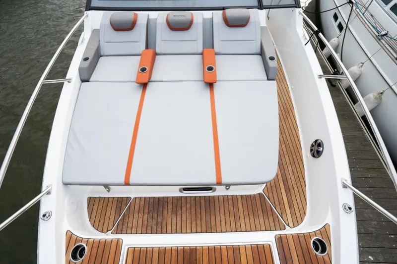 Slide: The Image of 2024 Beneteau Flyer 10 boat with spacious sunbathing area and teak deck. - 16