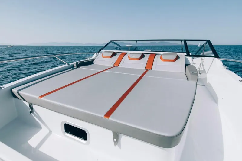 Slide: The Image of 2024 Beneteau Flyer 10 boat with spacious sunbathing deck on open water. - 17