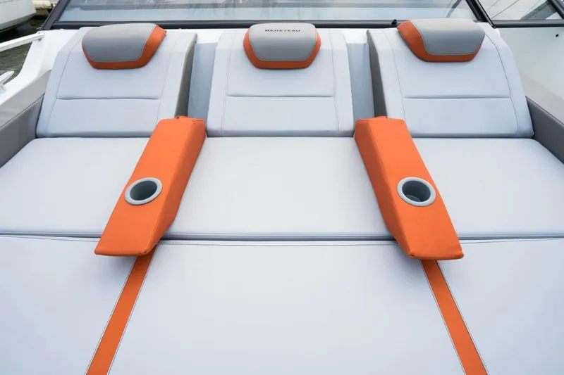 Slide: The Image of 2024 Beneteau Flyer 10 boat with orange and gray cushioned seating. - 19