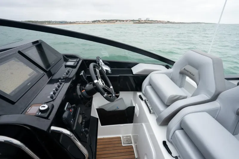 Slide: The Image of 2024 Beneteau Flyer 10 cockpit with modern navigation system and comfortable seating. - 21