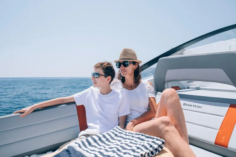 Slide: The Image of Family enjoying a sunny day on a 2024 Beneteau Flyer 10 boat. - 29