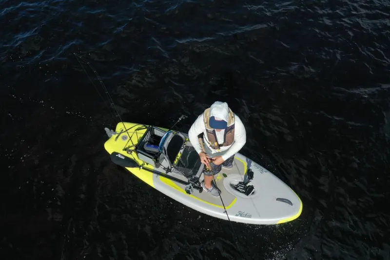 Slide: The Image of Aerial view of a person fishing on a 2023 Hobie iTrek 9 Ultralight kayak. - 8
