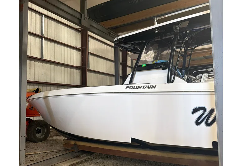 The Image of 2022 Fountain 34 Center Console boat in storage, showcasing sleek design and modern features. - 1