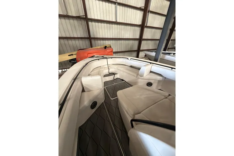 Slide: The Image of 2022 Fountain 34 Center Console boat interior with cushioned seating and sleek design. - 12