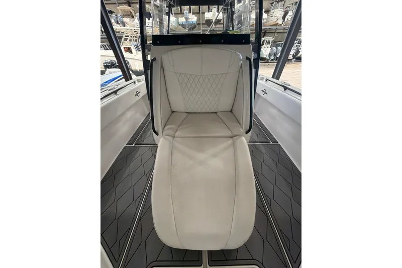 Slide: The Image of 2022 Fountain 34 Center Console boat interior with white cushioned seating. - 16