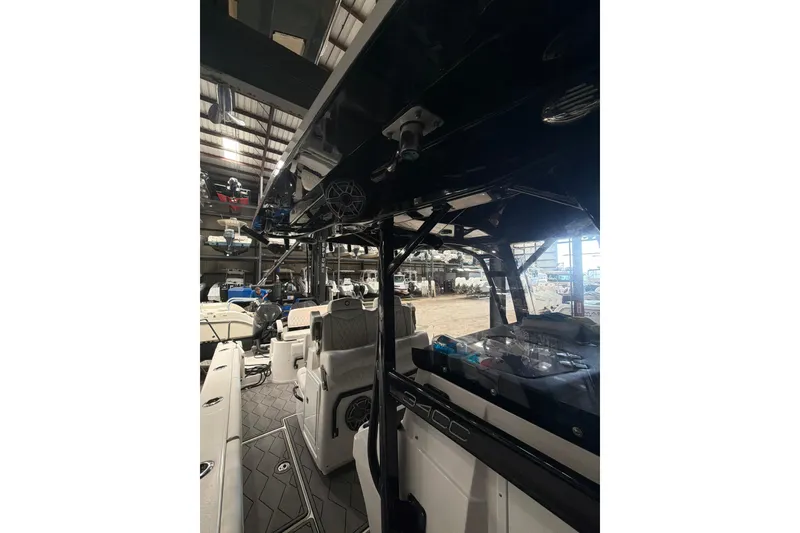 Slide: The Image of 2022 Fountain 34 Center Console boat interior in a warehouse setting. - 17