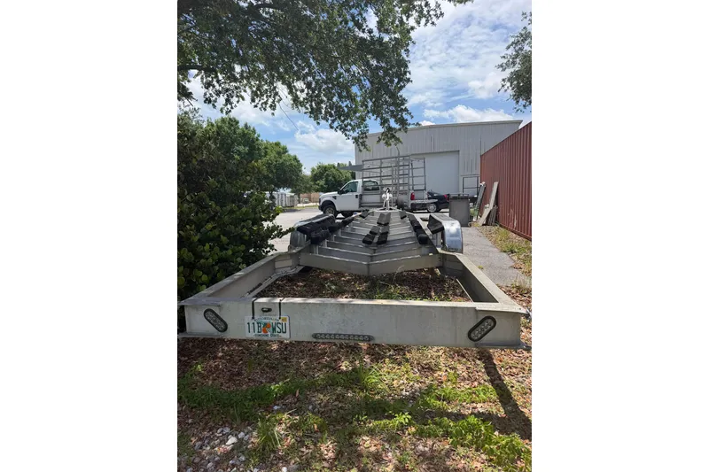 Slide: The Image of Trailer for 2022 Fountain 34 Center Console boat parked outdoors. - 27