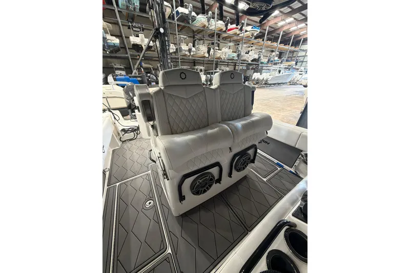 Slide: The Image of 2022 Fountain 34 Center Console boat interior with luxury seating and speakers. - 9