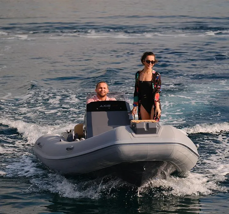 Slide: The Image of 2024 Northstar Axis 4.8 boat with two people enjoying a ride on the water. - 9