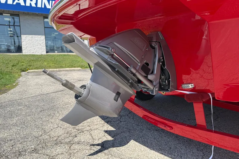Slide: The Image of 2025 Crownline Eclipse E235 boat's outdrive in a marina setting. - 3