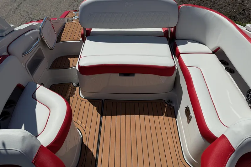 Slide: The Image of Luxurious seating on 2025 Crownline Eclipse E235 boat with red and white upholstery. - 5